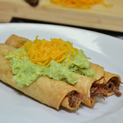 Three Rolled Tacos Guacamole