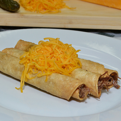 Three Rolled Tacos with Cheese